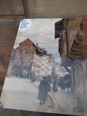 Aquarelle de Gustave Krafft (architecte) montrant la place Benjamin Zix vers 1900, sur un panneau informatif visible sur place